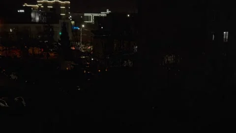 Night city view with glowing windows and distant building lights Stock Footage 333525385