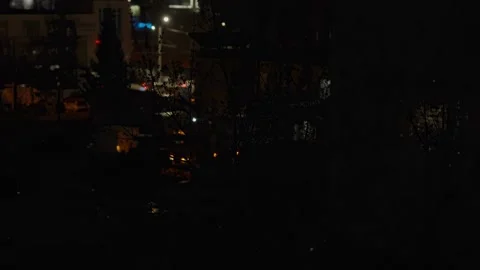 Night city view with glowing windows and distant building lights Stock Footage 333525391