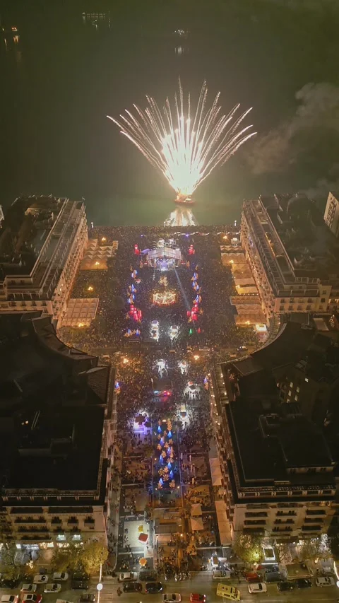 Night cityscape and coastal square New Year celebration, vertical Stock Footage 345935649