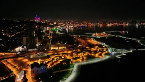 Night Cityscape Drone View with Illuminated Buildings and Coastline Stock Footage 341976212
