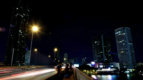 Night Cityscape: Elevated View of Traffic and Skyscrapers Stock Footage 310243702