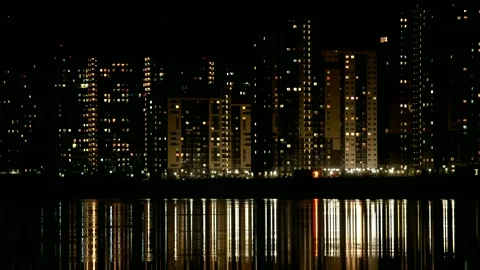 Night cityscape reflected in water time lapse Stock Footage 152157363