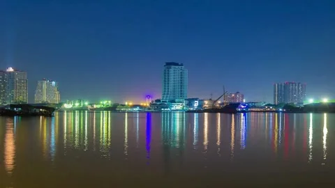 Night cityscape reflection on calm river water Stock-Footage 310242848