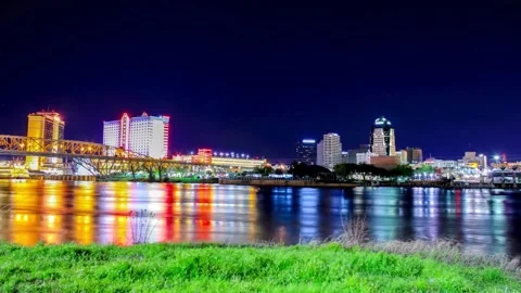 Night cityscape reflection over calm water Stock-Footage 310706005