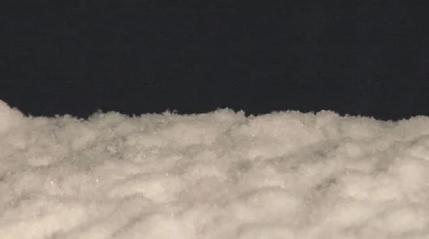 Night Close Up of Big Snow Flakes Accumulating Stock Footage 54717348