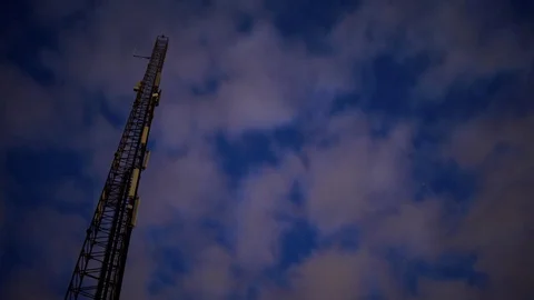 Night clouds passing mobile mast and the stars - Timelapse Stock Footage 81244466