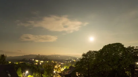 Night clouds time lapse with moon over small town Stock Footage 275828444