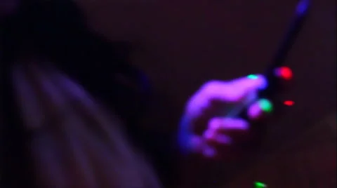 Night club - flying camera scenes - 1 cell phone in the dark Stock Footage