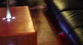 Night club lighting in action - 5 pole dance stage and couch HD Footage