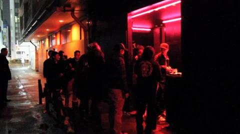 Night Club Queue Line in Tokyo: A Vibrant Urban Scene Under Red Neon Light 스톡 동영상 34932773
