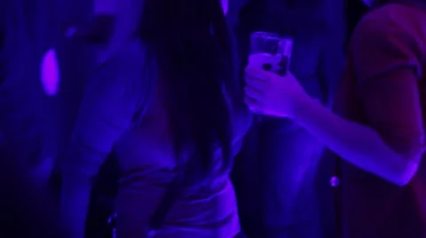 Night club's visitor dancing on the floor, enjoying herself Stock Footage