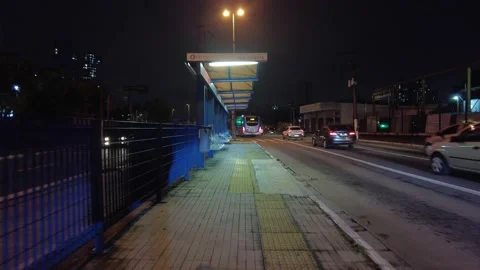 Night commuting of bus stop on  bus rapid transit corridor Stock Footage 147643285