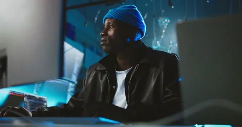 Night, computer and black man with coding, cyber security or thinking with Stock Footage 309827063