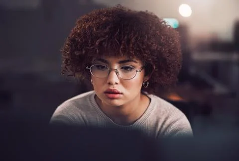 Night, computer and focus of black woman programmer, software developer or Stock Photos