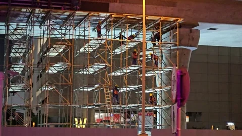 Night construction of a modern bridge structure with scaffolding Stock Footage 335343158