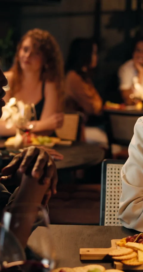 Night, couple and happy with talking in restaurant for first date, connection Stock Footage 329345863