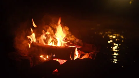 Night cozy campfire and mountain river in light of flashlight Stock Footage 326439666