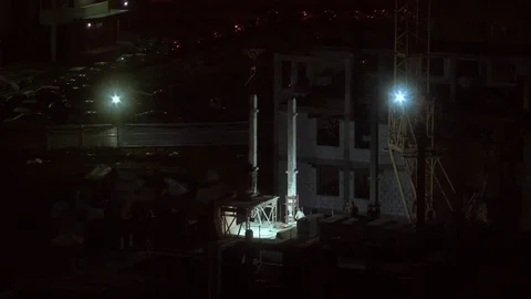 The night crew of builders working on object Stock Footage 74995287