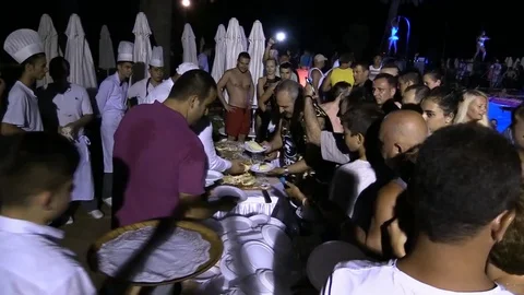 Night crowd active outdoor poolside party dinner Video stock 84144841