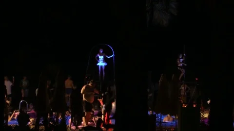 Night crowd active outdoor poolside party Stock Footage 84144857