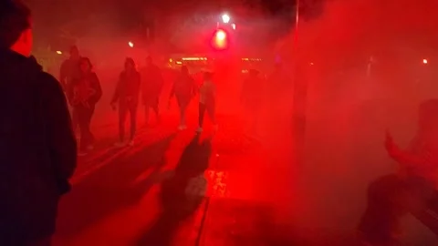 Night crowd walking through red smoke and fog at Carowinds park, Charlotte NC Stock Footage 318790522