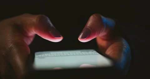 Night, cybersecurity and hands typing with phone for texting, internet troll or Stock Footage 309822688