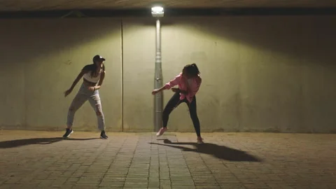 Night dancing, street performance and women with energy from music doing dance Video stock 212396214