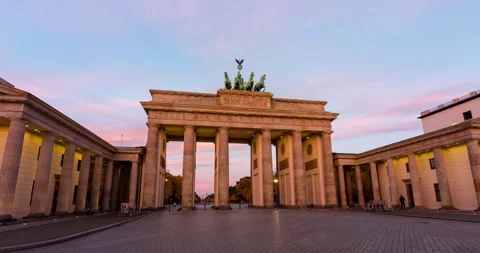 Night to day hyper lapse of the Brandenburg gate in Berlin with red sunrise Stock Footage 143416095