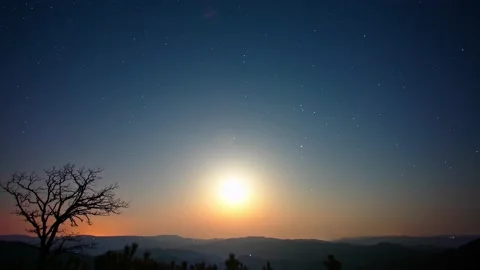 A night to day time-lapse of the changing of the light and shadows at sunrise Stock Footage 161369623