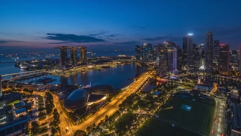 Night to day timelapse overlooking Marina Bay Sand in Singapore. Panning Left Stock Footage