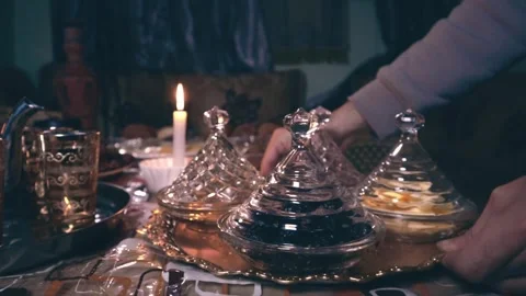 Night dining under candlelight in an Arabian atmosphere Stock Footage 303967612