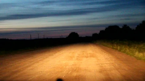 Night dirt road from a moving car Stock Footage