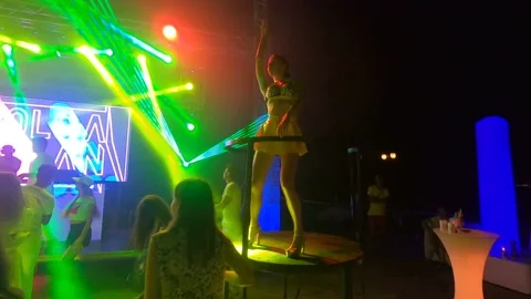 Night disco. DJ set. With laser show and go-go girls. Video stock 144284348