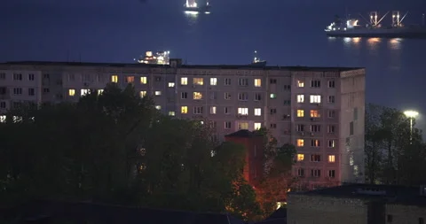 Night district shines with glowing windows and ship lights Stock Footage 320042800