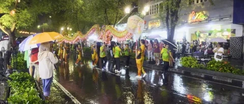 Night Dragon Parade In The Rain With Crowds Holding Umbrellas During Street Stock Footage 331980035