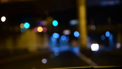 Night drive - bokeh, out of focus night driving in the rain, blurred traffic Stock Footage