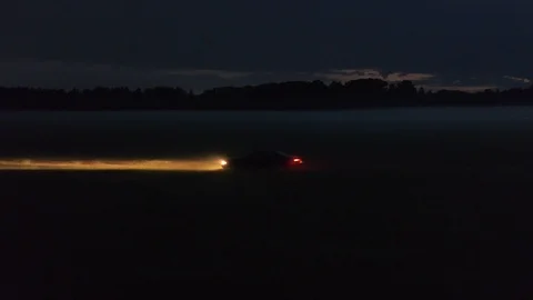 Night drive on the field Stock Footage 102775345
