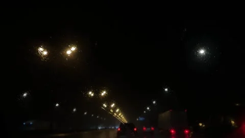 Night Drive in the Rain - POV Through Wet Windshield Stock Footage 321649626