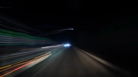 Night driving light trails timelapse through a city tunnel Video stock 342391767