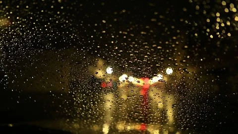 Night Driving with Rain Drops on Car Windshield with Traffic and City Lights Stock Footage 100514537