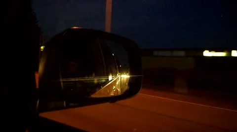 Night driving reflected in the rear view mirror Stock Footage 41429660