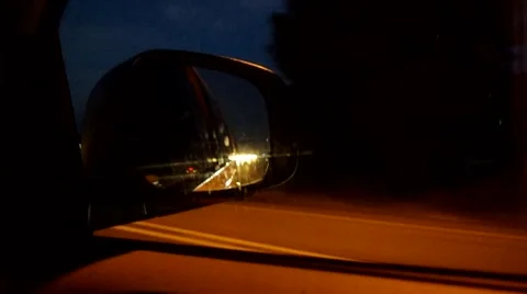 Night driving reflected in the rear view mirror Stock Footage 41429964