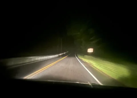 Night Driving View Through Windshield On Dark Curving Road Stock Photos