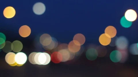 Night Driving. Windshield view blurred traffic lights in city. Busy town street Stock Footage 74992051