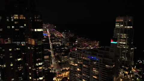 Night drone flight between Miami high rise buildings Stock Footage 328119477