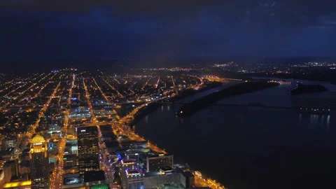 Night drone flight over downtown Louisville Kentucky and Ohio River Stock Footage 344421971