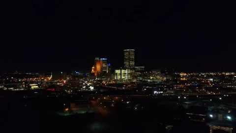 Night drone flight over downtown Tulsa Oklahoma displaying city lights Stock Footage 344722326