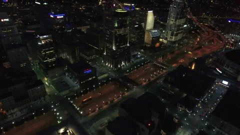 Night drone flight over downtown Cincinnati Ohio displaying city lights Stock Footage 344779982