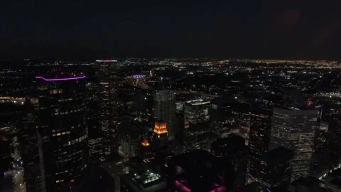 Night drone flight over downtown Houston Texas displaying city lights Stock Footage 344790964
