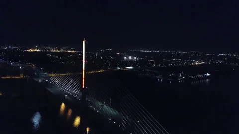 Night drone flight over Toledo Ohio showing Veterans Skyway on Maumee River Stock Footage 344718314